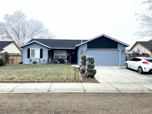 ranch-style home with a front yard and a garage