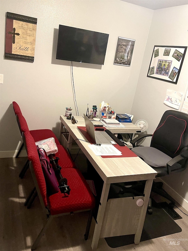 office space with hardwood / wood-style floors