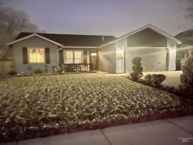 view of front of home with a porch and a garage