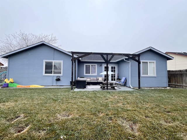 rear view of house featuring an outdoor hangout area, a yard, and a patio