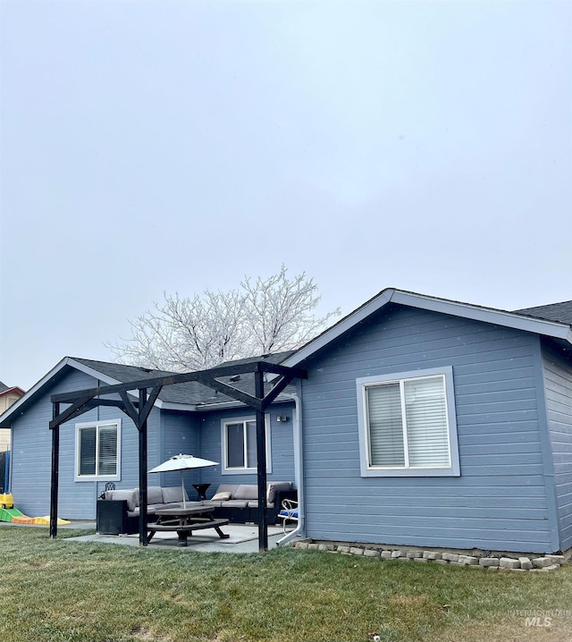 view of front of house featuring a patio area, a front lawn, and an outdoor hangout area