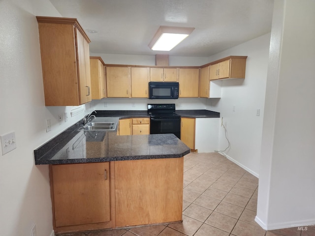 kitchen featuring light brown cabinetry, sink, black appliances, and kitchen peninsula