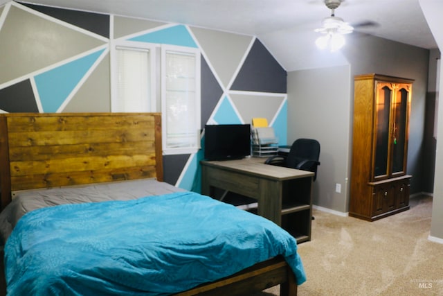 carpeted bedroom with vaulted ceiling and ceiling fan