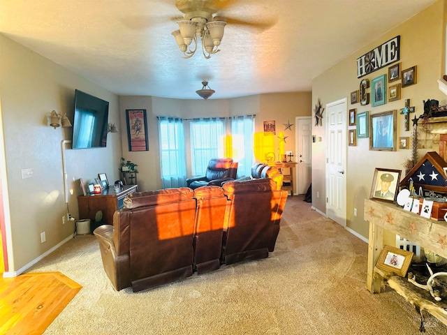 living room featuring carpet floors and ceiling fan