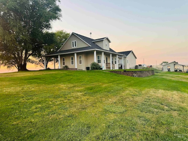 view of front of property with a yard