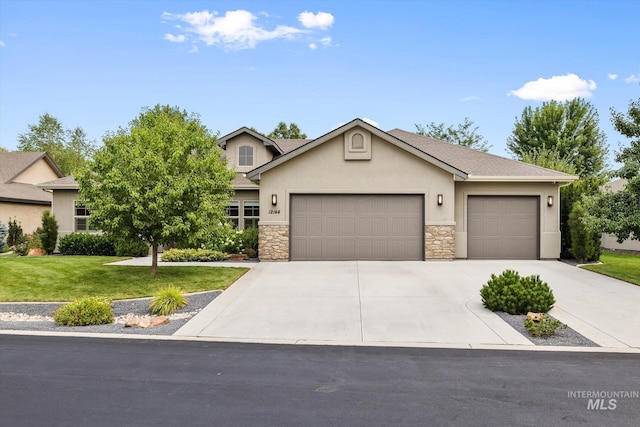 view of front of property with a garage and a front yard