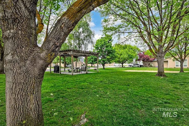 8079 W Beckton Ln, Garden City, ID 83714 - surrounding community with a pergola, a patio area, and a lawn