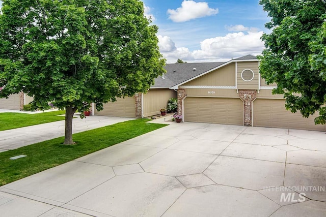 8079 W Beckton Ln, Garden City, ID 83714 - view of front of property featuring concrete driveway, a front lawn, brick siding, and roof with shingles