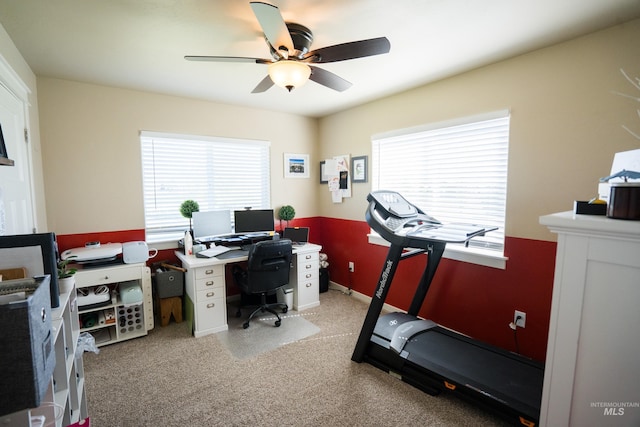 office space with ceiling fan and light carpet