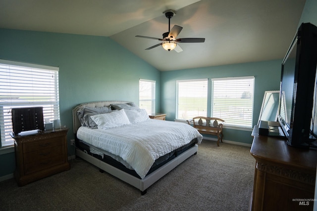 carpeted bedroom with lofted ceiling, a ceiling fan, and multiple windows