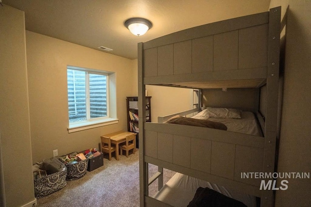 carpeted bedroom with visible vents