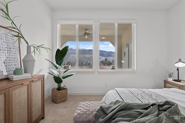 bedroom featuring carpet and baseboards