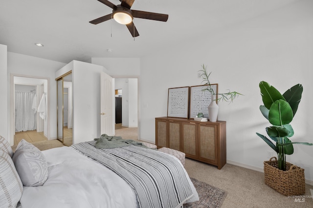 bedroom featuring light carpet, ceiling fan, and baseboards