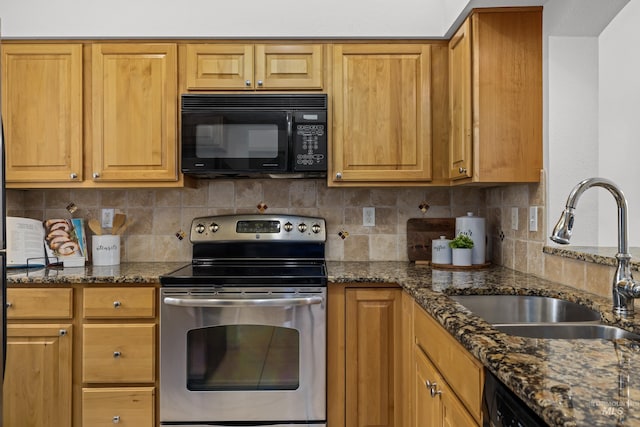 kitchen featuring dishwashing machine, a sink, stainless steel range with electric cooktop, black microwave, and backsplash