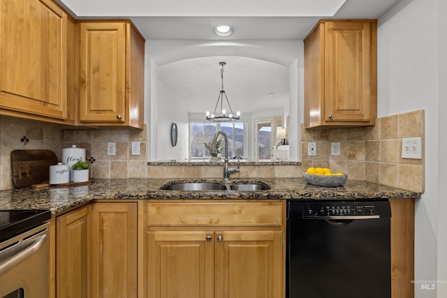 kitchen featuring black dishwasher, decorative backsplash, an inviting chandelier, a sink, and dark stone countertops