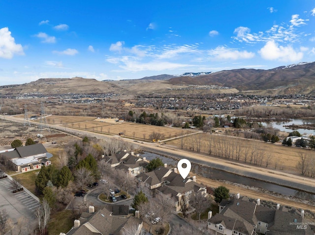 birds eye view of property with a mountain view