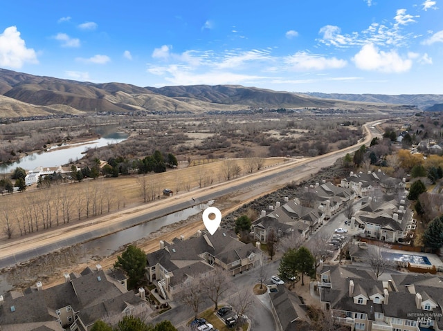 birds eye view of property with a residential view and a water and mountain view