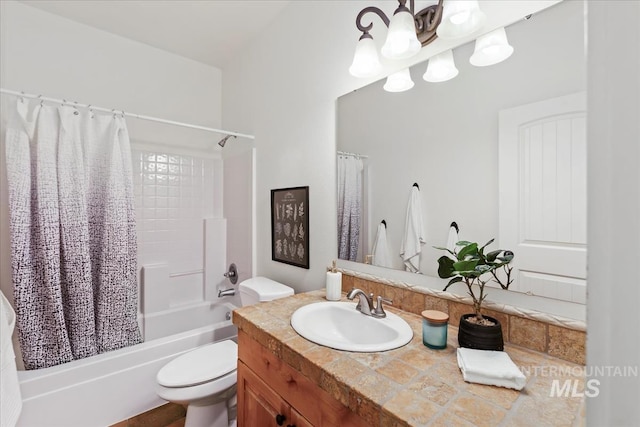 full bath featuring vanity, shower / tub combo, and toilet