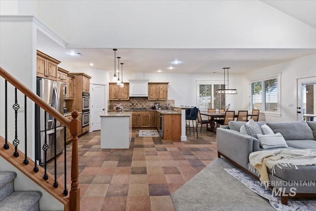 living area featuring recessed lighting and stairs