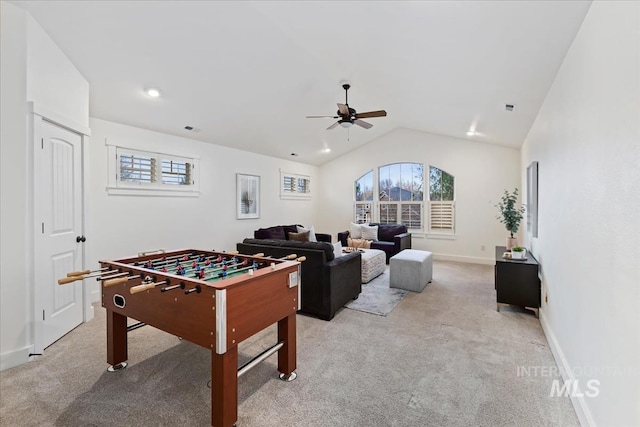 game room featuring visible vents, ceiling fan, baseboards, light colored carpet, and vaulted ceiling