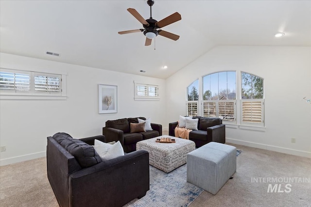 carpeted living area with visible vents, a ceiling fan, baseboards, and vaulted ceiling