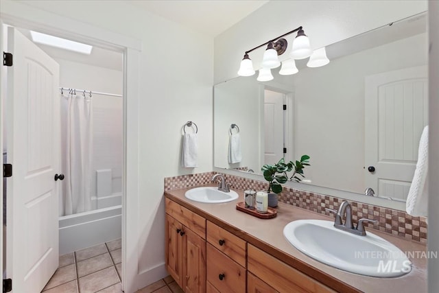 full bathroom with a sink, tasteful backsplash, double vanity, and tile patterned flooring