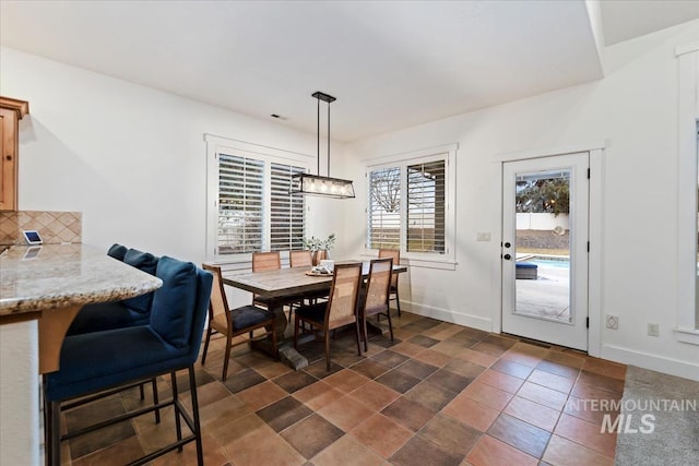 dining room with baseboards