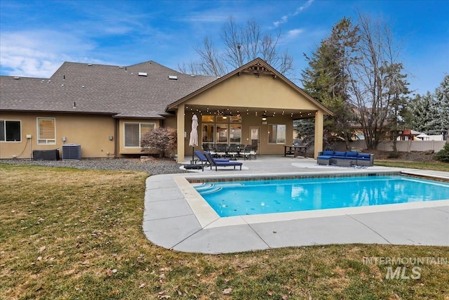 view of swimming pool with a fenced in pool, an outdoor hangout area, a yard, a patio area, and a ceiling fan