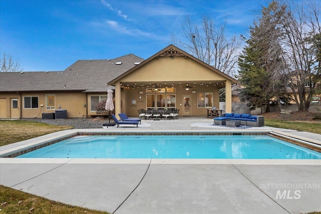 pool with an outdoor living space, central air condition unit, a patio area, and ceiling fan