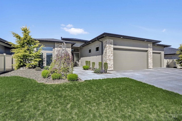 2313 S Aburge Ave, Meridian, ID 83642 - view of front of property with stucco siding, stone siding, a garage, and concrete driveway