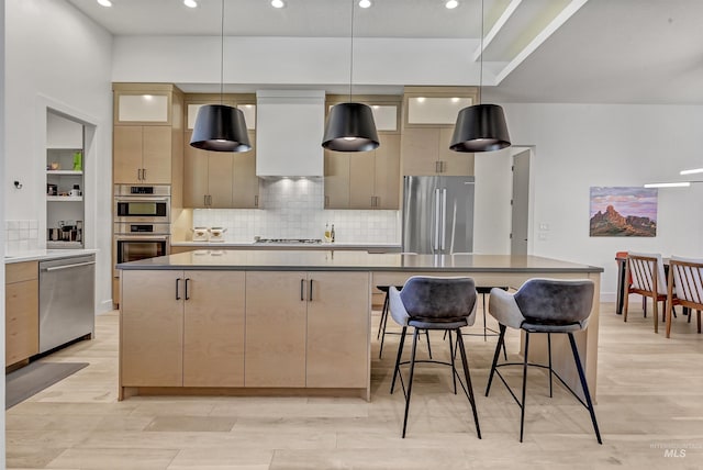 2313 S Aburge Ave, Meridian, ID 83642 - kitchen with stainless steel appliances, premium range hood, a spacious island, decorative backsplash, and recessed lighting