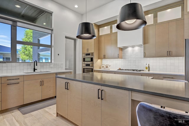 2313 S Aburge Ave, Meridian, ID 83642 - kitchen featuring a sink, backsplash, stainless steel appliances, recessed lighting, and pendant lighting