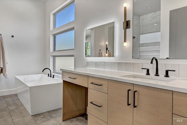 2313 S Aburge Ave, Meridian, ID 83642 - full bath featuring tiled shower, vanity, a freestanding tub, tasteful backsplash, and a towering ceiling