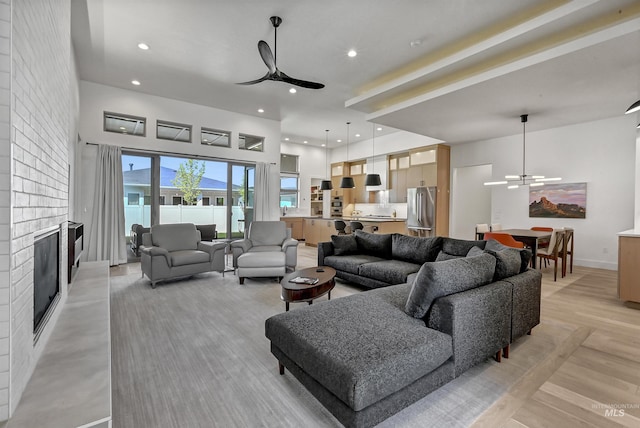 2313 S Aburge Ave, Meridian, ID 83642 - living room with a ceiling fan, a fireplace, recessed lighting, and baseboards
