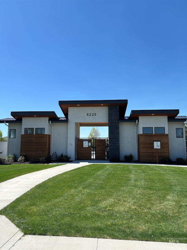 2313 S Aburge Ave, Meridian, ID 83642 - view of front facade with concrete driveway, stucco siding, and a front lawn