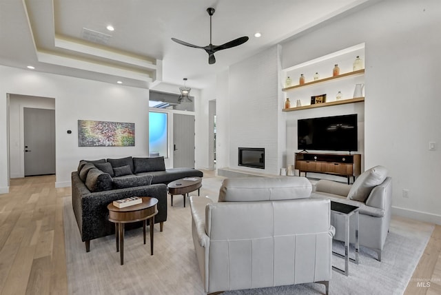 2313 S Aburge Ave, Meridian, ID 83642 - living area featuring a ceiling fan, light wood-type flooring, baseboards, recessed lighting, and a large fireplace