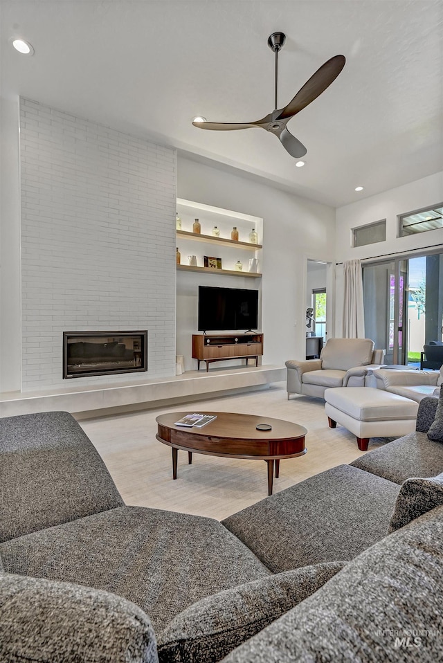 2313 S Aburge Ave, Meridian, ID 83642 - living area with ceiling fan, plenty of natural light, recessed lighting, wood finished floors, and a fireplace