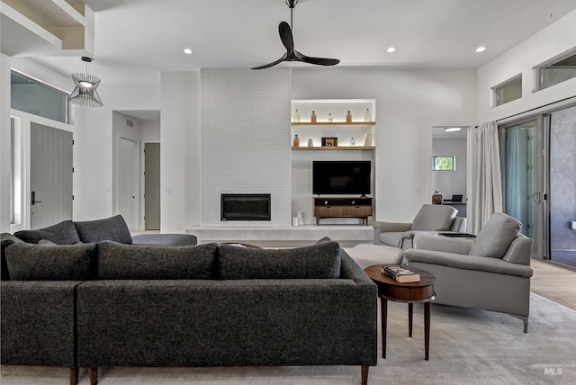 2313 S Aburge Ave, Meridian, ID 83642 - living room with a brick fireplace, recessed lighting, a ceiling fan, and light wood-type flooring