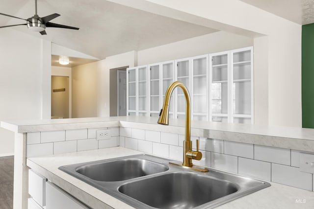942 S Stibnite Pl, Kuna, ID 83634 - kitchen view of a sink, light countertops, ceiling fan, and white cabinets