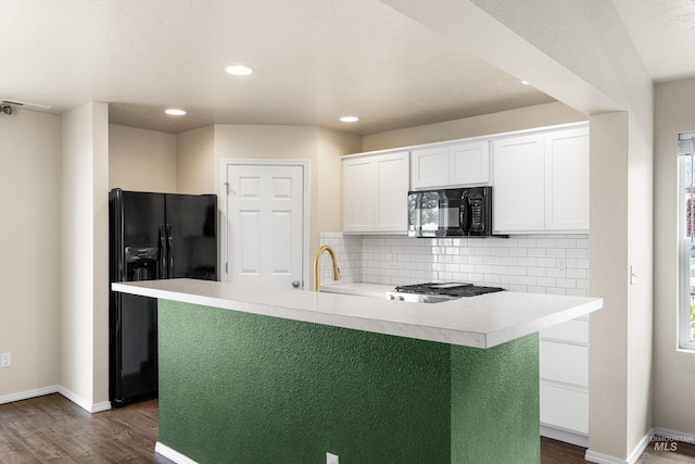 942 S Stibnite Pl, Kuna, ID 83634 - kitchen featuring black appliances, dark wood finished floors, light countertops, white cabinets, and baseboards