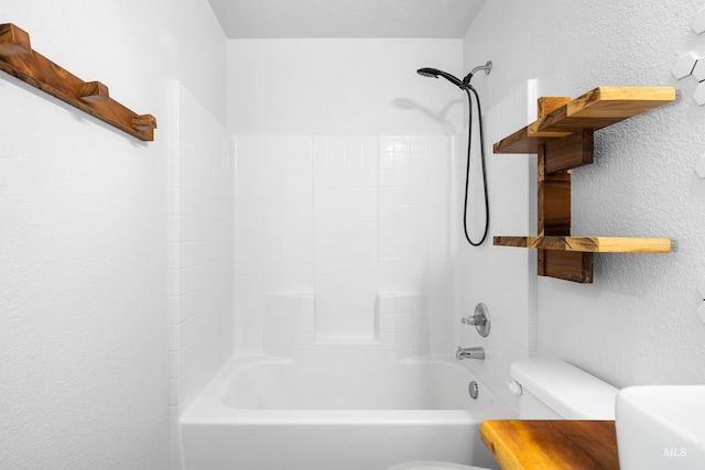 942 S Stibnite Pl, Kuna, ID 83634 - full bath with toilet, bathtub / shower combination, and a textured wall