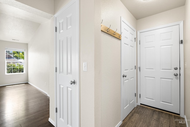 942 S Stibnite Pl, Kuna, ID 83634 - hallway featuring dark wood finished floors and baseboards