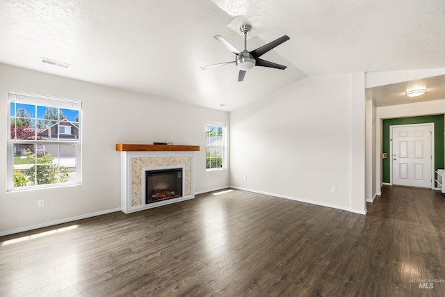 942 S Stibnite Pl, Kuna, ID 83634 - unfurnished living room with ceiling fan, healthy amount of natural light, dark wood-style flooring, and lofted ceiling