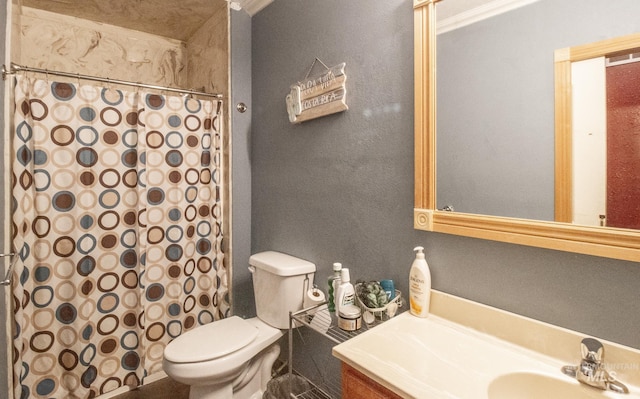 bathroom with vanity, curtained shower, and toilet