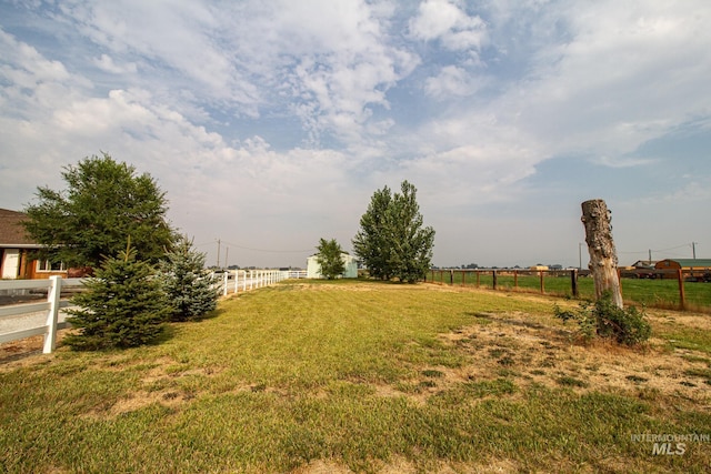 view of yard with a rural view