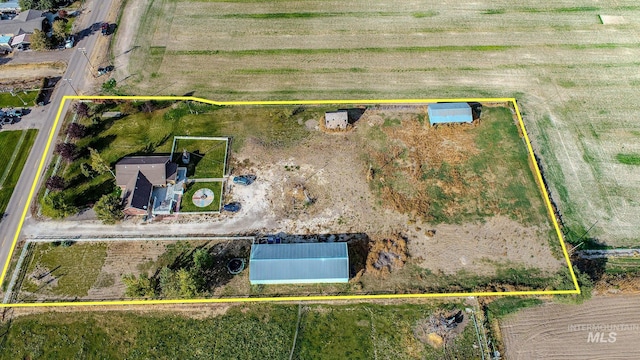 birds eye view of property featuring a rural view