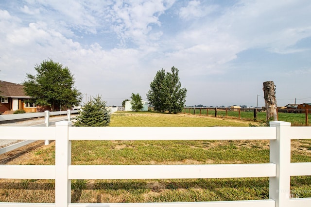 view of yard with a rural view