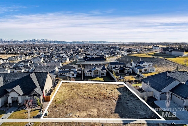 birds eye view of property with a mountain view