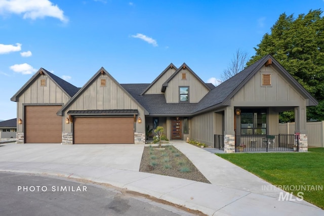 view of front of home featuring a garage and a front lawn