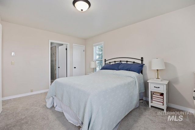 carpeted bedroom with baseboards